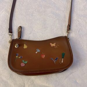 Coach purse with flowers and vegetables print